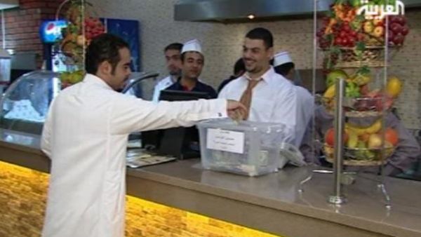 Paying a fine for not finishing his food. [via Alarabiya]