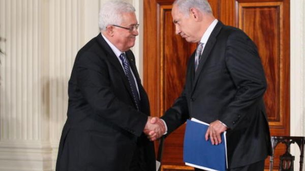 Palestinian Authority President Mahmoud Abbas (L) shakes hands with Israeli Prime Minister Benjamin Netanyahu.