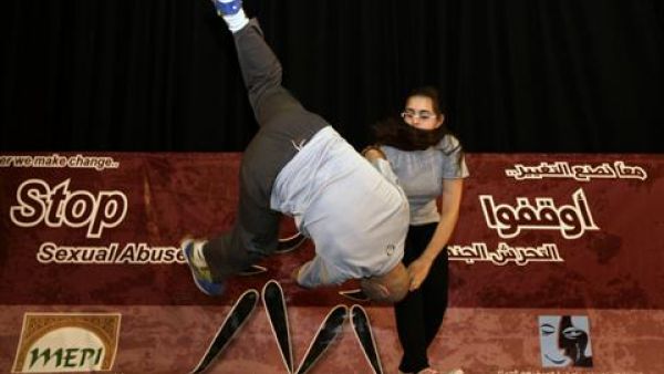 A girl demonstratesher newly acquired Aikido skills