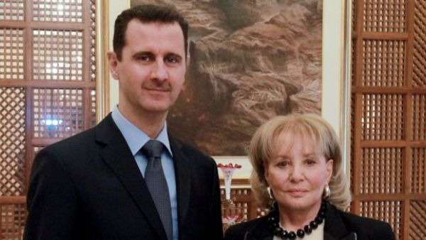 Bashar Al-Assad pictured with a somber Barbara Walters. (Image courtesy of "mail.com")
