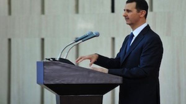President Bashar Assad gives speech at an "iftar" meal on the last week of the Muslim holy month of Ramadan with political and religious figures in Damascus on August 4, 2013. (AFP)