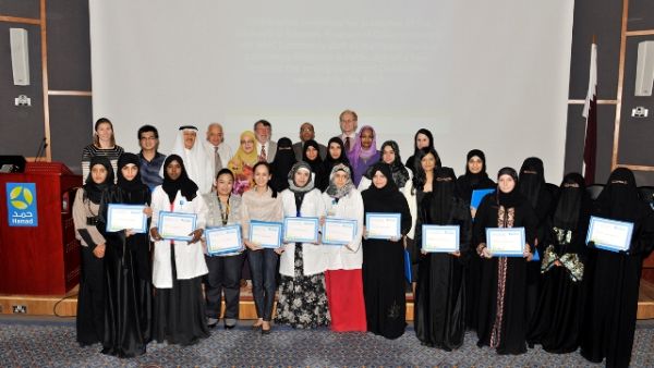 Dr. Ajayeb and Dr. Eiman flanked by ASCP Graduates during HMC ceremony