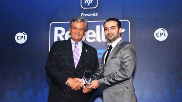 Cesare Cardone, CEO of GBM, accepts the award on behalf of the company