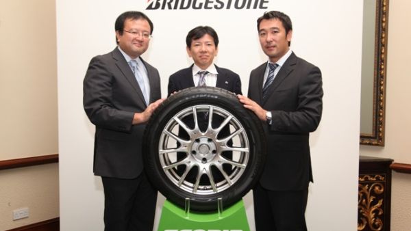 Shoichi Sakuma, President of Bridgestone MEA with two other executives