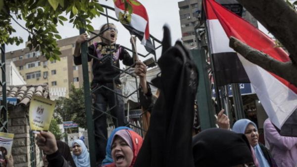 Egypt is a society divided by Morsi's moves and the referendum