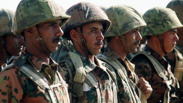 Egyptian soldiers stand at attention.