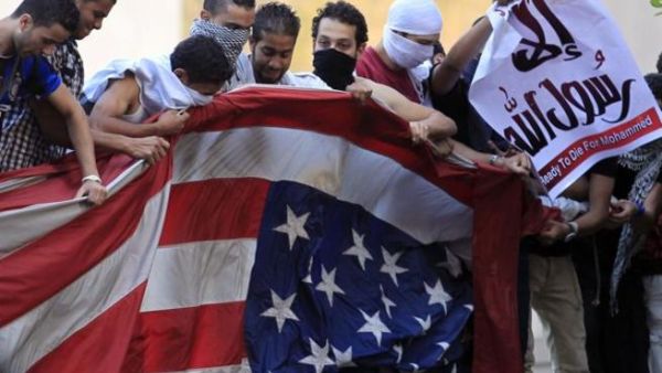 Egyptian protestors tore down the American flag and hung and Islamic one in its stead.