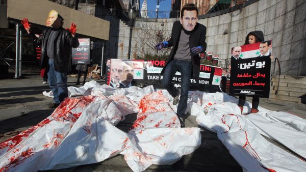 Shown for illustrative purposes- Demonstrating actors in New York, speaking out against Bashar and Putin.