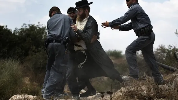 Extremist right-wing settlers from Yitzhar clashed with Israeli security forces over the destruction of illegally built homes. (AFP/File)