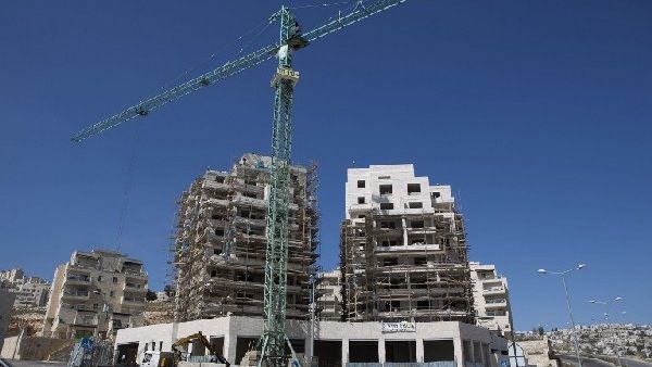 Labourers work on the construction of home in the Israeli settlement of Har Homa in Israeli annexed Arab East Jerusalem (file AFP)