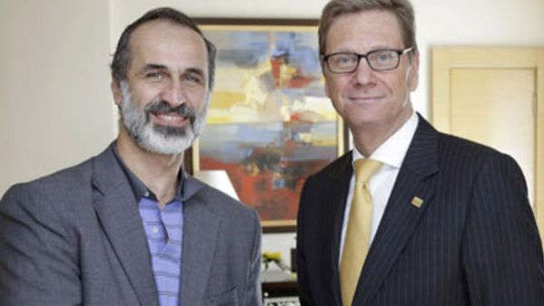 Moaz al-Khatib with the German foreign minister in Cairo.