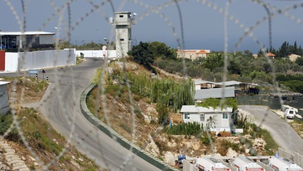A picture taken through barbed wire on August 10, 2013 shows the base of the Turkish engineering construction company, an unit of the United Nations Interim Force in Lebanon (UNIFIL) in the southern Lebanese village of Saitah. (AFP/MAHMOUD ZAYYAT)