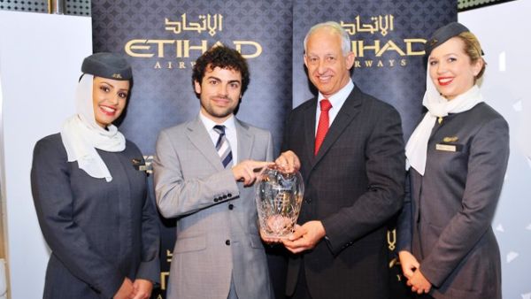 Luca Romozzi, Expedia’s Business Development Manager for the Middle East presenting the award to Daniel Barranger, Etihad’s Vice President of Global Sales Luca Romozzi, Expedia’s Business Development Manager for the Middle East presenting the award to Daniel Barranger, Etihad’s Vice President of Global Sales
