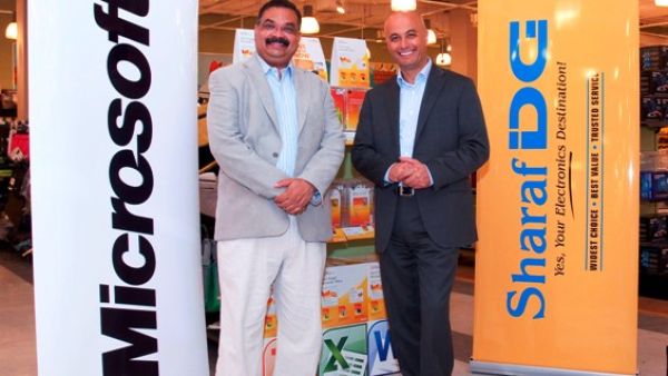 Samer Abu-Ltaif, Microsoft Gulf Regional Manager, with Nilesh Khalkho, CEO of Sharaf DG