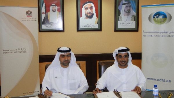 Younis Haji Al Khoori, Undersecretary of MoF and Mohammed Saif Al Suwaidi, Acting Director General of ADFD during the signing