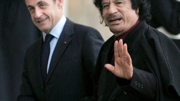Nocolas Sarkozy cozies up with the late Gaddafi