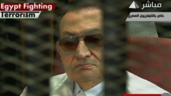 An image grab taken from the Egyptian state TV shows Egypt's ousted dictator Hosni Mubarak sitting in the defendants' cage on August 25, 2013 during his trial in Cairo. (AFP/Egyptian TV)