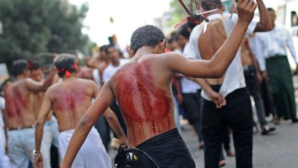 A Shia boy flogs himself during the Ashura celebrations in Myanmar.
