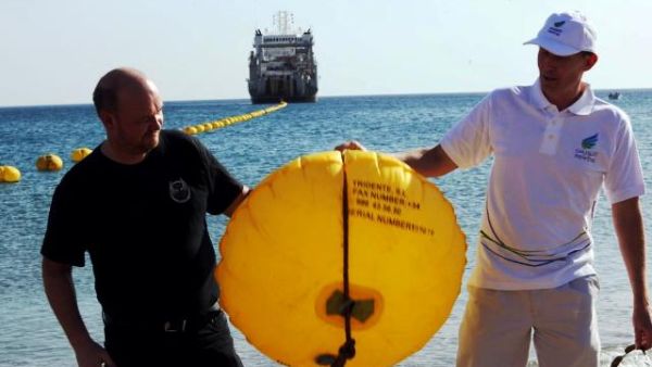 Peter Rubeck and Tore Solberg cut first buoy in landing ceremony Peter Rubeck and Tore Solberg cut first buoy in landing ceremony