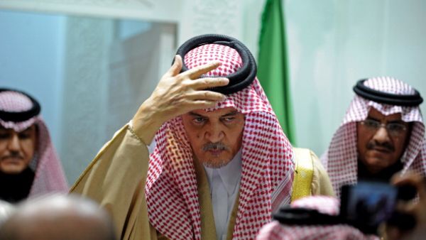 Saudi Foreign Minister Prince Saud al Faisal as he adjusts his keffiyeh (FAYEZ NURELDINE/AFP/Getty Images)
