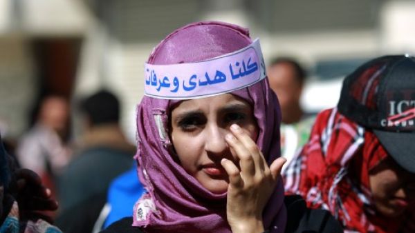 A Yemeni girl takes part in a gathering in support with Saudi young woman Huda al-Niran outside the courthouse during her trial on November 24, 2013 in the capital Sanaa. (AFP)