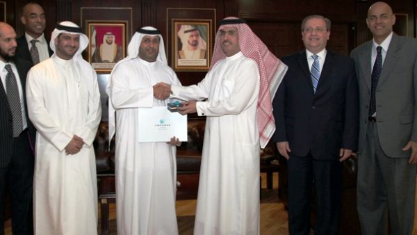 Ahmed Bin Shafar, CEO of Empower and Saeed Al Tayer, Chairman of Empower, shaking hands during the board meeting Ahmed Bin Shafar, CEO of Empower and Saeed Al Tayer, Chairman of Empower, shaking hands during the board meeting