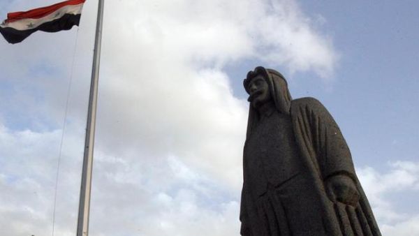 The Syrian flag flies high above a statue of Sultan Pasha al-Attrash in Swaida. (Photo: Ahram English)