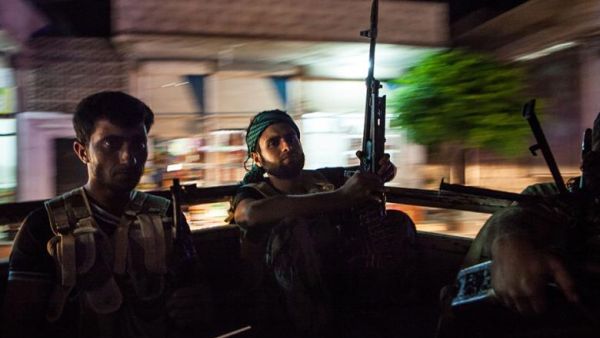Syrian rebels head to the town of Bsankol in the northwestern province of Idlib to join comrades fighting regime forces for the control of the highway that connects Idlib with Latakia on 11 July 2013. (AFP/File) Syrian rebels head to the town of Bsankol in the northwestern province of Idlib to join comrades fighting regime forces for the control of the highway that connects Idlib with Latakia on 11 July 2013. (AFP/File)