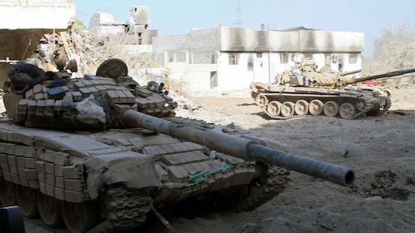 Syrian army tanks are seen deployed in the Jobar neighbourhood of Damascus on August 24, 2013. (AFP)