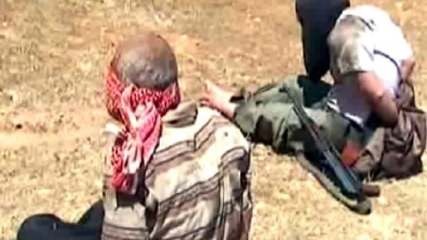 A handout image grab released by the Syrian Arab News Agency (SANA) on Friday allegedly shows blindfolded rebel fighters detained after a Syrian army ambush in the area of Shamsin in the rebel stronghold of Qusair. AFP/SANA