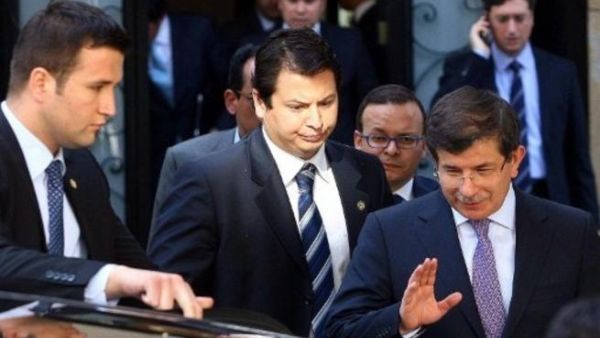Turkish Foreign Minister, Ahmet Davutoglu leaves a briefing on Syria yesterday