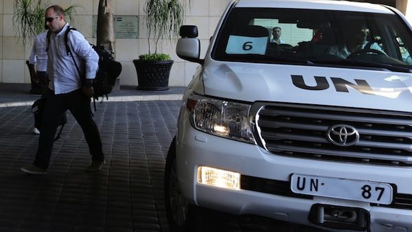 The UN chemical weapons investigation team arrives in Damascus on August 18, 2013. (AFP)