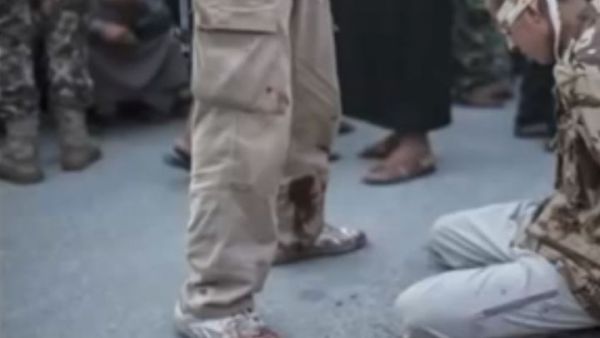 One of the men executed by Syrian rebels in a location outside of Aleppo. (Image: Youtube screenshot)