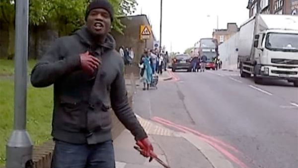 A screen grab of one of the suspects wielding a knife after beheading a man in London on Wednesday. 