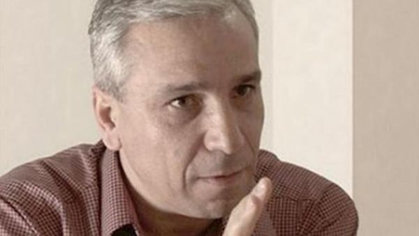 Yassine al-Haj Saleh (top) and part of the jacket of his book on 16 years in Syrian jails.