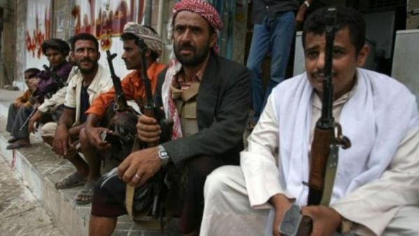 Armed Yemeni men wait for what will happen next in Al Dhale.