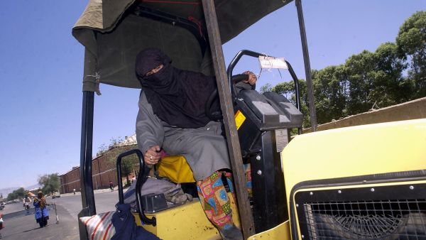 How will their non-too pleased male counterparts react to lady drivers sweeping the Kingdom? Will they urge the Kingdom's
men to beat their wives back to the passenger seat where they belong? In Afghanistan (shown above) women started driving
for practical work reasons after Taliban retreat.