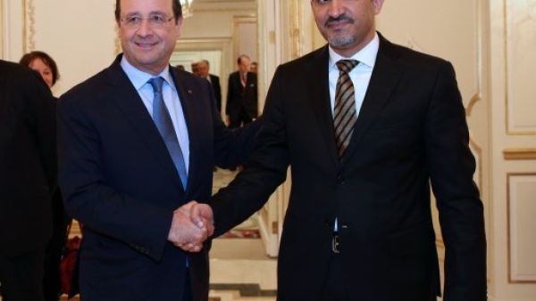 Syrian opposition leader Ahmad Jarba met with French president Francois Hollande earlier this week in Saudi Arabia. The opposition leader has not yet confirmed his group's participation in the Swiss peace conference scheduled for January (Kenzo Tribouillard/AFP)