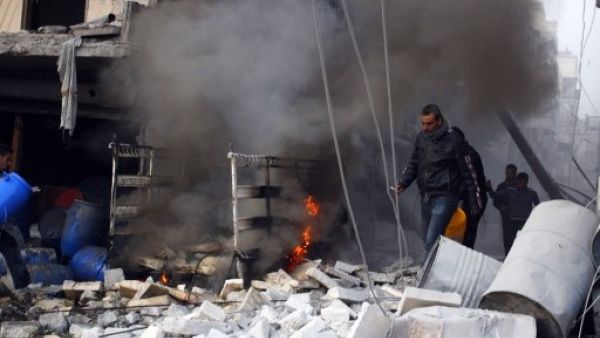 Regime airstrikes targeting a rebel compound left 26 dead Saturday after the attack missed its target and hit the nearby Nafasin market (Mohammed Al Khatieb/AFP)