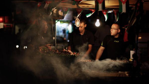 Jordanians enjoying grilled meat and time with friends through the lens of Amer Sweidan.
