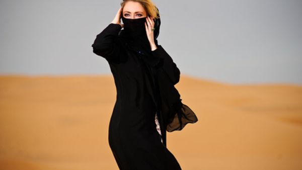 Women can wear anything they like underneath their Abayas. (Image: Shutterstock)