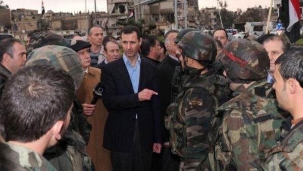 الرئيس السوري بشار الاسد خلال زيارته لبابا عمرو في حمص