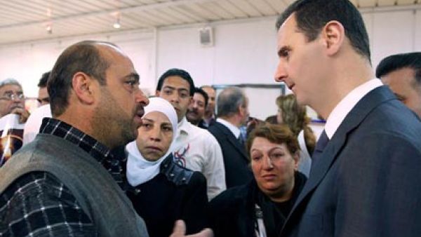 Syrian President Assad makes a rare public appearance at an electrical plant in Damascus. (image AFP/Uprooted Palestinians)