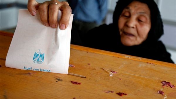 An Egyptian woman casts her vote at a polling station. 
