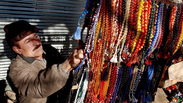 Faris Al Faris with the giant rosary that took him 18 months to complete. He has carved on the beads the 99 names of Allah, all the prophets’ names as well as the Shahada.