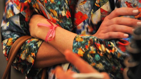 Fighting a multitude of cancers through healthier life-styles and awareness campaigns, represented by a rainbow of ribbons:
 Pink for breast cancer, Green for liver cancer....