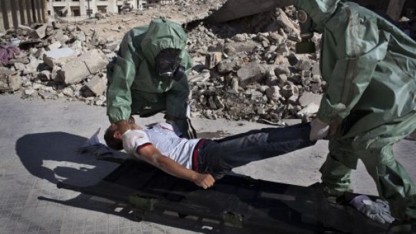 The UN chemical weapons team are expected to arrive in Damascus in Wednesday. Here, residents in Aleppo stage a drill for a potential weapons attack. (AFP/File)