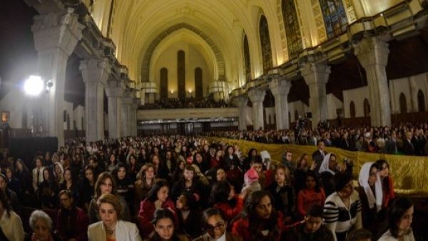 Coptic Christians gather for midnight mass in Cairo (Mohamed Al Shahed/AFP)