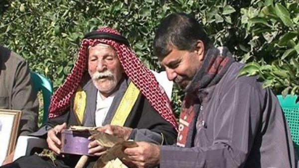 Omar Rajab Mohammad Toum says the secret of living 125 years is his diet. He mainly eats olive oil and thyme for breakfast and rabbit meat every day for lunch (Courtesy of Al-Arabiya)