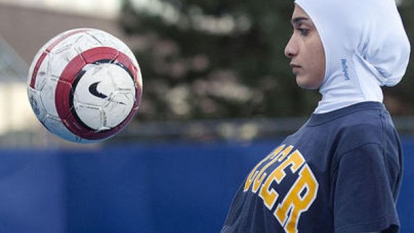 When sports federations ban women's dress,  you'd hope it was in the name of aero-dynamics. FIFA and the international basketball federation have come down on devout girls' dress,  including or rather excluding, veil and 'vests'.